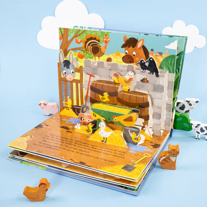 Children's pop-up book with farm animals on a blue background